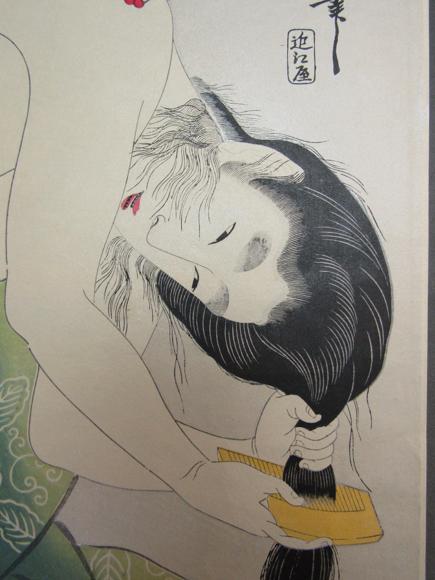 "A baby and a woman with a hairdresser" Utamaro Woodblock print